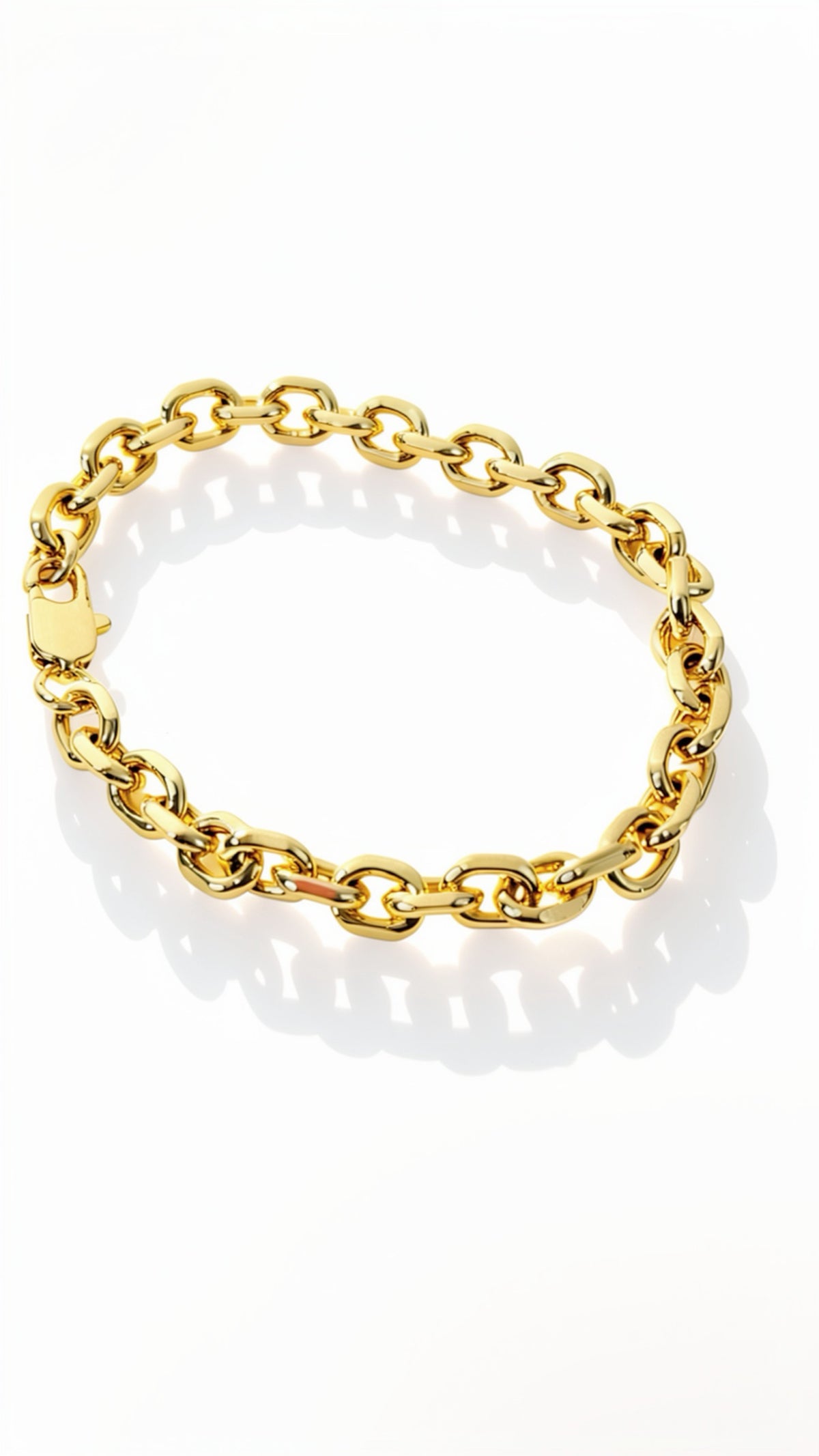A gold chain link bracelet with a polished finish and a lobster clasp, displayed on a clean white background with a soft shadow.